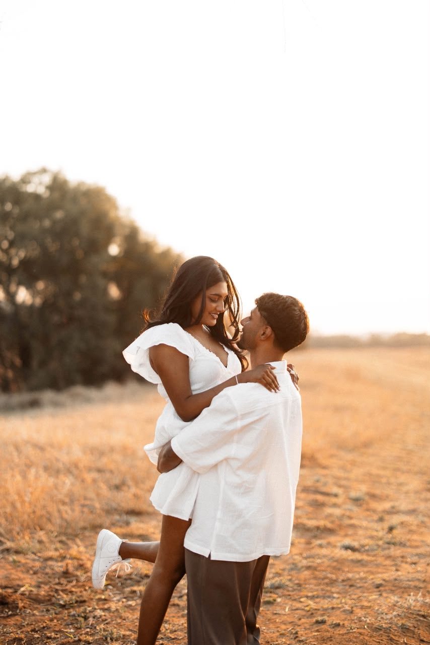 Zivan lifting Amelia at sunset